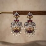 Oxidized silver and gold dual-tone peacock-motif dangle earrings