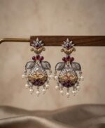 Oxidized silver and gold dual-tone peacock-motif dangle earrings